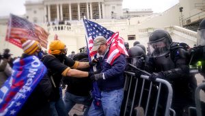 Trump supporters try to break through a police barrier, Wednesday, Jan. 6, 2021, at the Capitol in Washington. | PHOTO: John Minchillo / AP