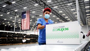 Boxes containing the Moderna vaccine are prepared to be shipped at the McKesson distribution center in Olive Branch, Miss., on December. 20, 2020. | PHOTO: Paul Sancya / AP file