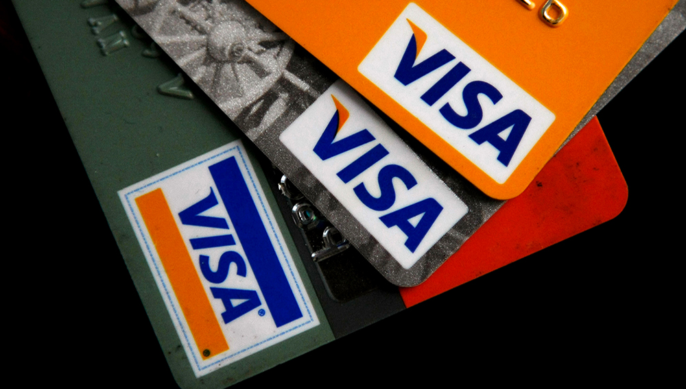 Visa credit cards are arranged on a desk February 25, 2008 in San Francisco, California. (Photo Illustration by Justin Sullivan/Getty Images)