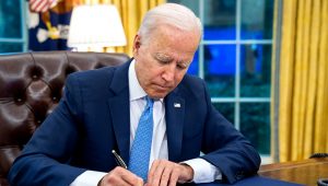 President Joe Biden signs the Emergency Reparation Assistance for Returning Americans Act, Tuesday, August 31, 2021, in the Oval Office of the White House. (Official White House Photo by Adam Schultz)