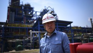 A Sinopec employee looks on in Polypropylene Plant No3 of the Sinopec Yanshan Petrochemical Company (SYPC) during a tour arranged by the State Council Information Office in Beijing on May 25, 2018. (Photo by WANG Zhao / AFP)