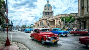 The Cuban capitol and colorful traffic. PHOTO: Vlad Baciu / Alamy Stock Photo
