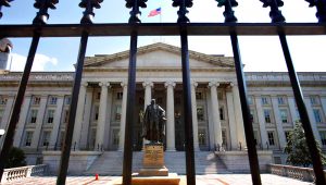 In this Monday, Aug. 8, 2011, file photo, a statue of former Treasury Secretary Albert Gallatin stands guard outside the Treasury Building in Washington, D.C. (AP Photo/Jacquelyn Martin, File)