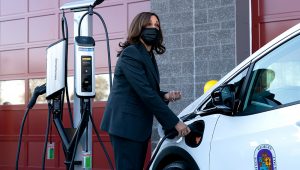 Vice President Kamala Harris charges an electric vehicle in one of the charging stations during her tour of the Brandywine Maintenance Facility in Prince George's County, Md., highlighting the electric vehicle investments in the bipartisan infrastructure law and the "Build Back Better Act" Monday, Dec. 13, 2021. (AP Photo/Manuel Balce Ceneta)