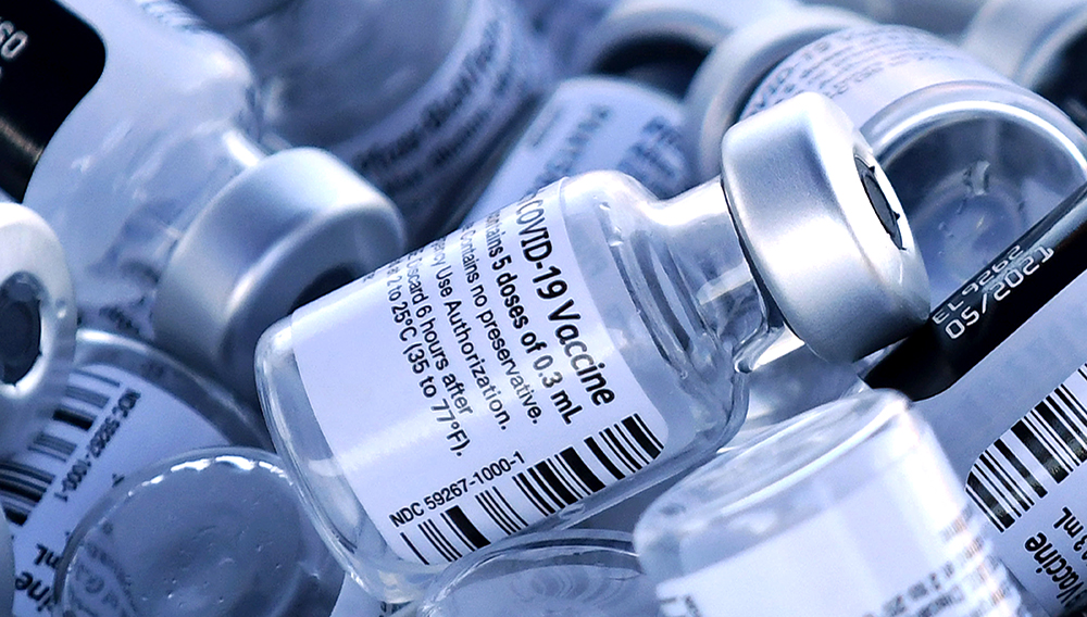 Empty vials of the Pfizer COVID-19 vaccine are seen at a first come first serve drive-thru vaccination site operated by the Lake County Health Department on January 28, 2021 in Groveland, Florida. | PHOTO: Paul Hennessy | NurPhoto | Getty Images