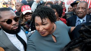 Stacey Abrams speaks with member of the press after crossing the the Edmund Pettus Bridge commemorating the 55th anniversary of the "Bloody Sunday" march in Selma, Alabama, U.S., March 1, 2020. REUTERS/Michael A. McCoy/File Photo