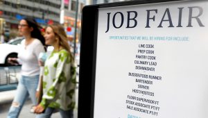 Signage for a job fair is seen on 5th Avenue after the release of the jobs report in Manhattan, New York City, U.S. REUTERS/Andrew Kelly