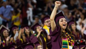 Diana Padilla cheers during the student address at the Arizona State University Hispanic Convocation in Wells Fargo Arena Saturday morning on May 13, 2017. | PHOTO: Deanna Dent/ASUNow