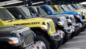 Unsold 2023 Gladiator pickup trucks sit in a long row at a Jeep dealership Sunday, June 18, 2023, in Englewood, Colo. The Commerce Department issues its third and final estimate of how the U.S. economy performed in the first quarter of 2023. (AP Photo/David Zalubowski)