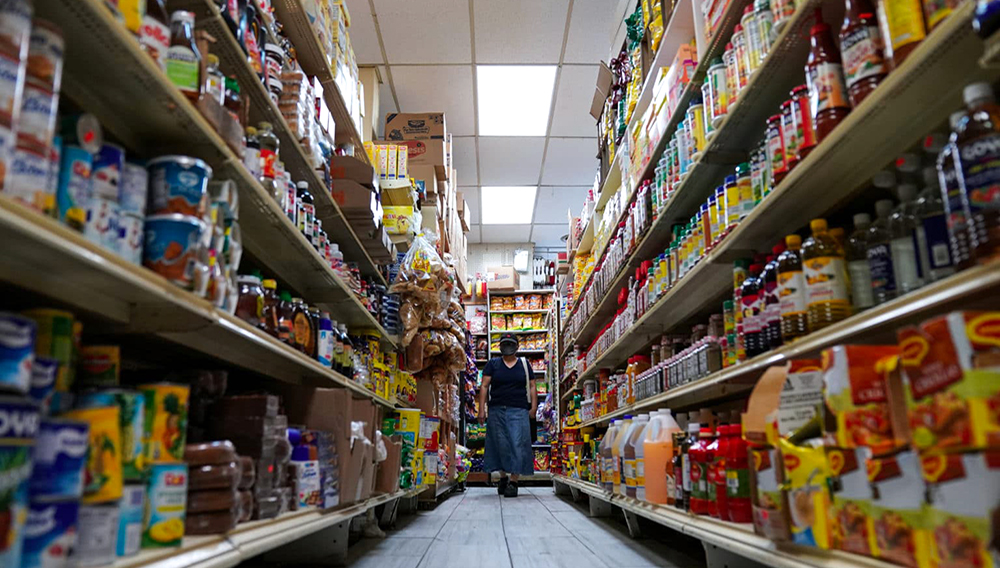 A woman shops for groceries at El Progreso Market in the Mount Pleasant neighborhood of Washington, D.C., U.S., August 19, 2022. REUTERS/Sarah Silbiger