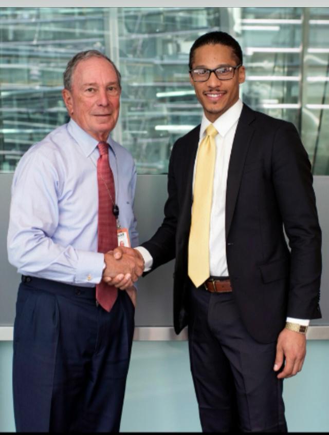 Marco Whittaker, Director of Business Relations at Garden State Inspections, next to former New York Mayor Michael Bloomberg.