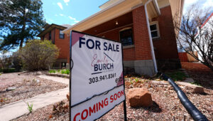 PHOTO: A for sale sign stands outside a home on Wednesday, April 3, 2024, in Denver. Holding out for more attractive mortgage rates could give homebuyers some financial breathing room. (AP Photo/David Zalubowski)