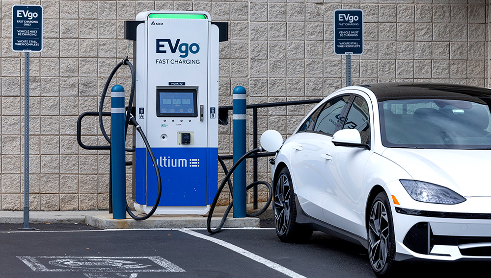 An electric vehicle is seen charging in New Jersey on June 11, 2024. | Amanda Andrade-Rhoades for NPR.