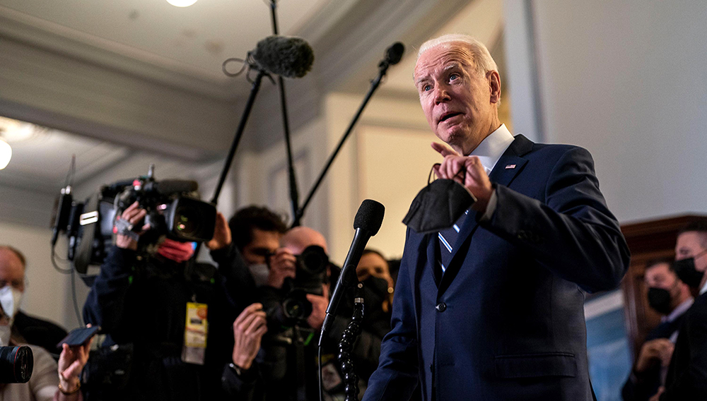 Biden speaks to the press after attending a meeting with the Senate Democratic Caucus on Capitol Hill. | Kent Nishimura/Los Angeles Times/Getty Images