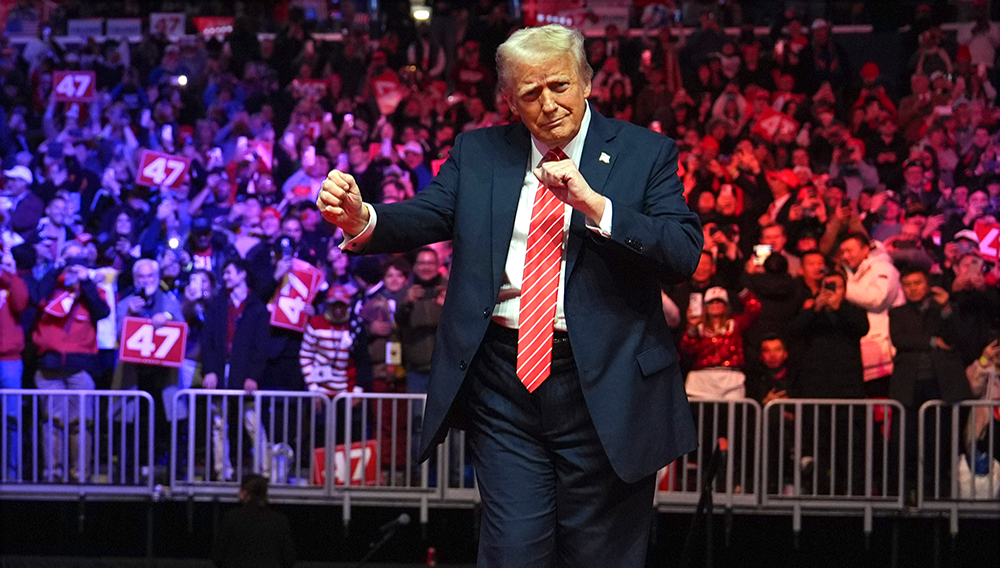 President-elect Donald Trump dances with The Village People at a rally ahead of the 60th Presidential Inauguration, Sunday, Jan. 19, 2025, in Washington. (AP Photo/Evan Vucci)