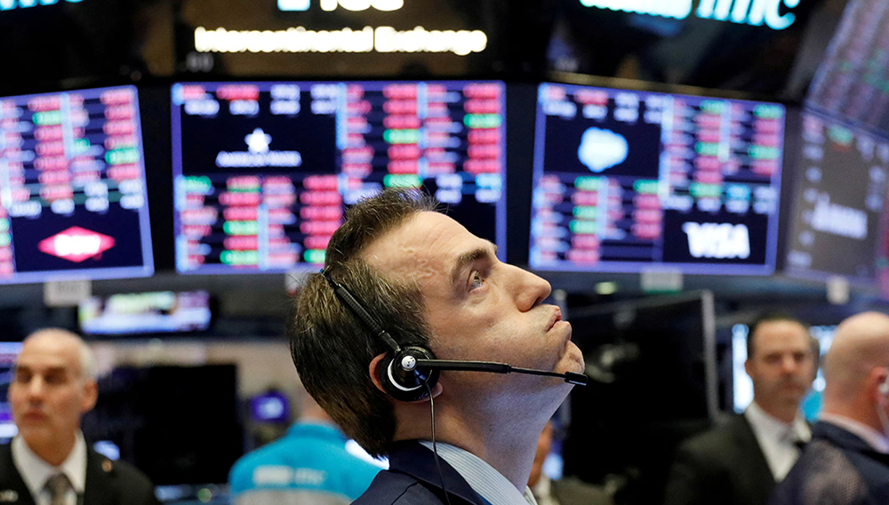 A trader works on the floor of the New York Stock Exchange shortly before the closing bell as the market takes a significant dip in New York, U.S., February 25, 2020. REUTERS/Lucas Jackson