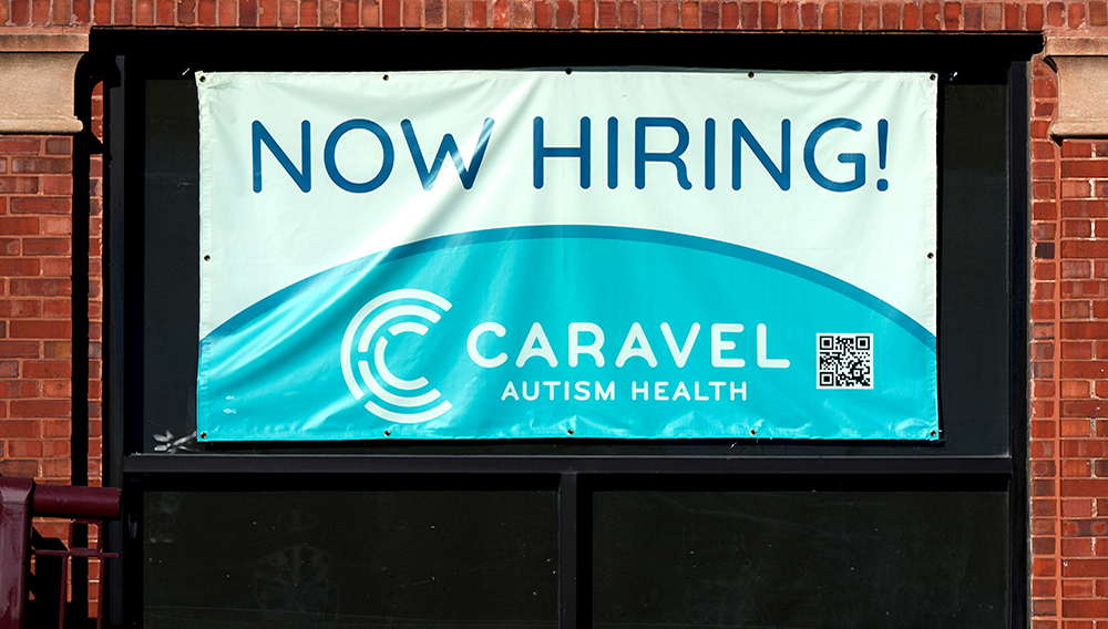 Hiring sign is displayed at a health service center in Chicago, Tuesday, Jan. 21, 2025. (AP Photo/Nam Y. Huh)