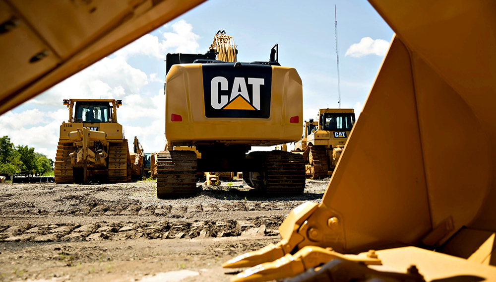 A Caterpillar Inc. excavator sits outside Altorfer Cat in East Peoria, Illinois, U.S., on Tuesday, July 21, 2015. | PHOTO: Daniel Acker/Bloomberg