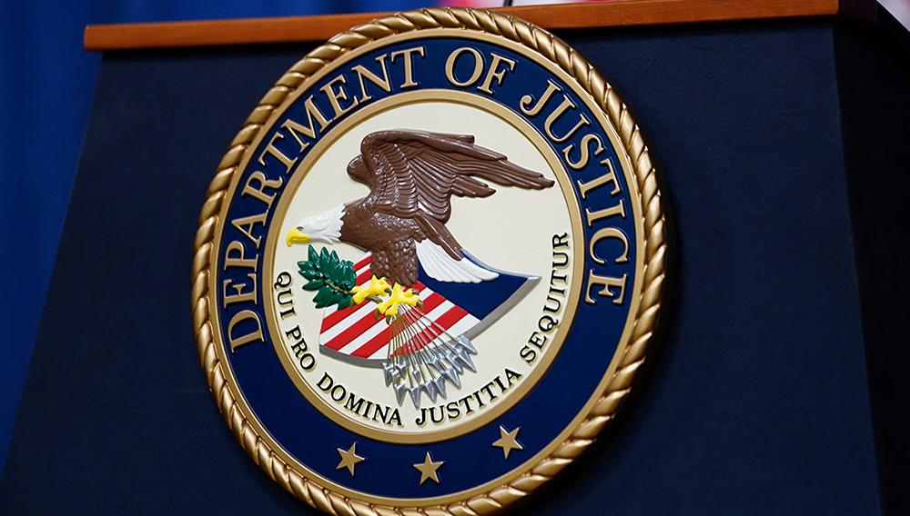 The seal of the U.S. Justice Department is seen on the podium in the Department's headquarters briefing room before a news conference with the Attorney General in Washington, January 24, 2023. REUTERS/Kevin Lamarque