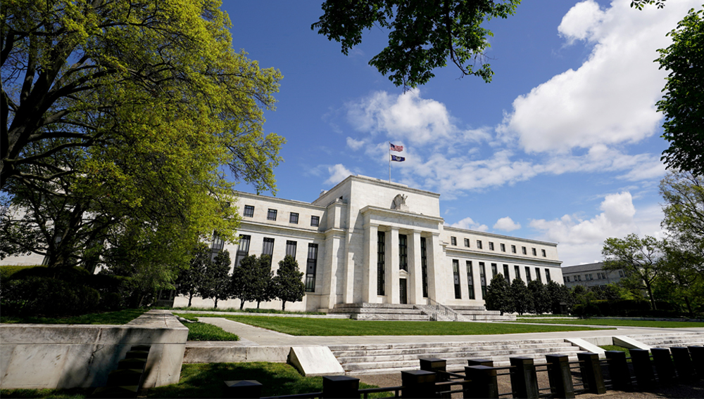 The Federal Reserve building is set against a blue sky in Washington, U.S., May 1, 2020. REUTERS/Kevin Lamarque
