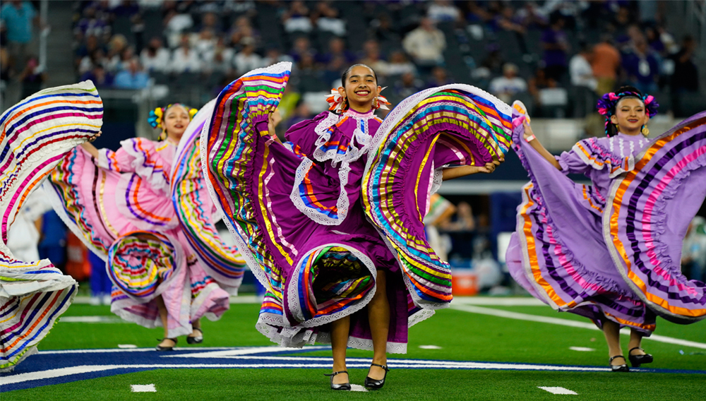 A folklorico dance group performs at haltfime of an NFL football game between the Baltimore Ravens and Dallas Cowboys in Arlington, Texas, Sunday, Sept. 22, 2024. (AP Photo/Jeffrey McWhorter)