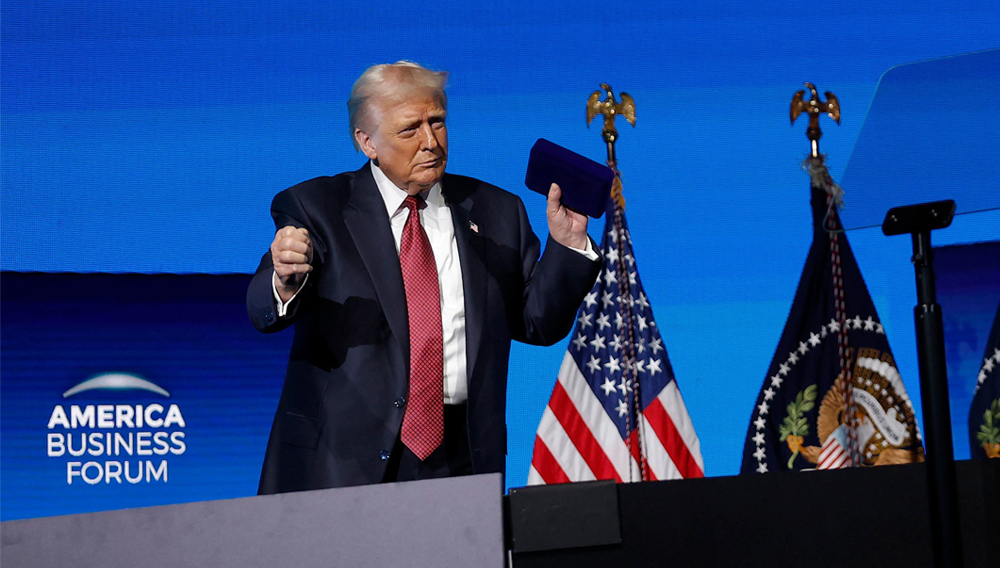 U.S. President Donald Trump dances after speaking at the America Business Forum at the Kaseya Center on November 05, 2025 in Miami, Florida. Kevin Dietsch/Getty Images/AFP