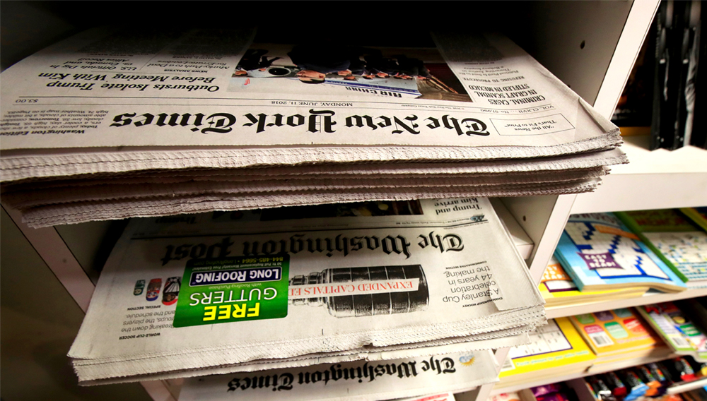 Newspapers are displayed magazine and newspaper stand, June 11, 2018, in Washington. (AP Photo/Manuel Balce Ceneta)