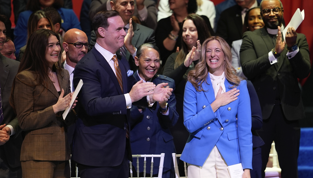 People stand and applaud for New Jersey Governor Mikie Sherrill during her inauguration ceremony in Newark, N.J., Tuesday, Jan. 20, 2026. (AP Photo/Seth Wenig)