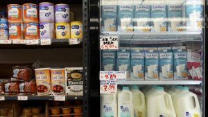 Pantry staples, including infant formula and dairy products, are sold at a market serving the Central American immigrant community in the Westlake/Pico Union area of Los Angeles, Tuesday, April 7, 2026. (AP Photo/Damian Dovarganes)