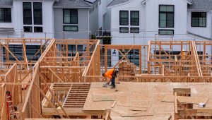 A drone view shows a construction worker performing tasks on a multi-home residential project by Shea Homes in Encinitas, California, U.S. July 21, 2025. REUTERS/Mike Blake