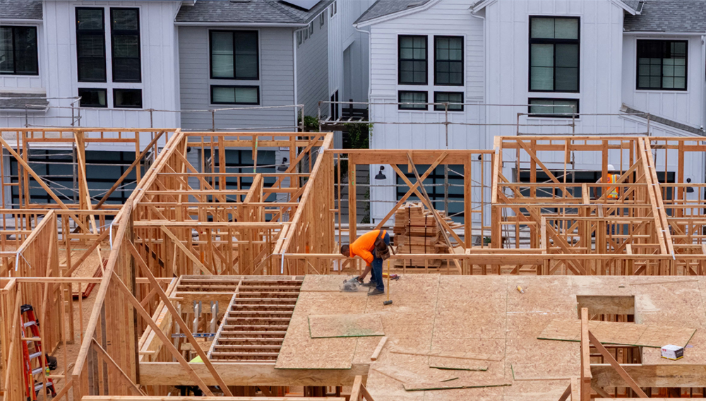 A drone view shows a construction worker performing tasks on a multi-home residential project by Shea Homes in Encinitas, California, U.S. July 21, 2025. REUTERS/Mike Blake