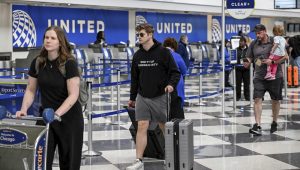 Passengers walk through the United Airlines terminal at Chicago O'Hare International Airport in Chicago, Illinois, U.S., April 14, 2026. REUTERS/Joshua Lott.