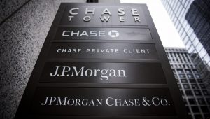 Signage stands on display outside the JPMorgan & Chase Tower in downtown Chicago, Illinois, U.S., on Saturday, Oct. 7, 2017. Photographer: Christopher Dilts/Bloomberg