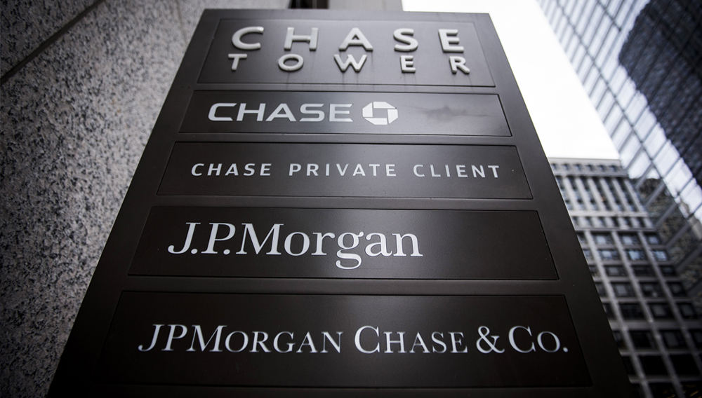 Signage stands on display outside the JPMorgan & Chase Tower in downtown Chicago, Illinois, U.S., on Saturday, Oct. 7, 2017. Photographer: Christopher Dilts/Bloomberg