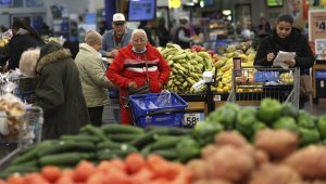 Customers shop for groceries at a Walmart Supercenter retail store in North Bergen, New Jersey, U.S., November 21, 2025. REUTERS/Mike Segar.