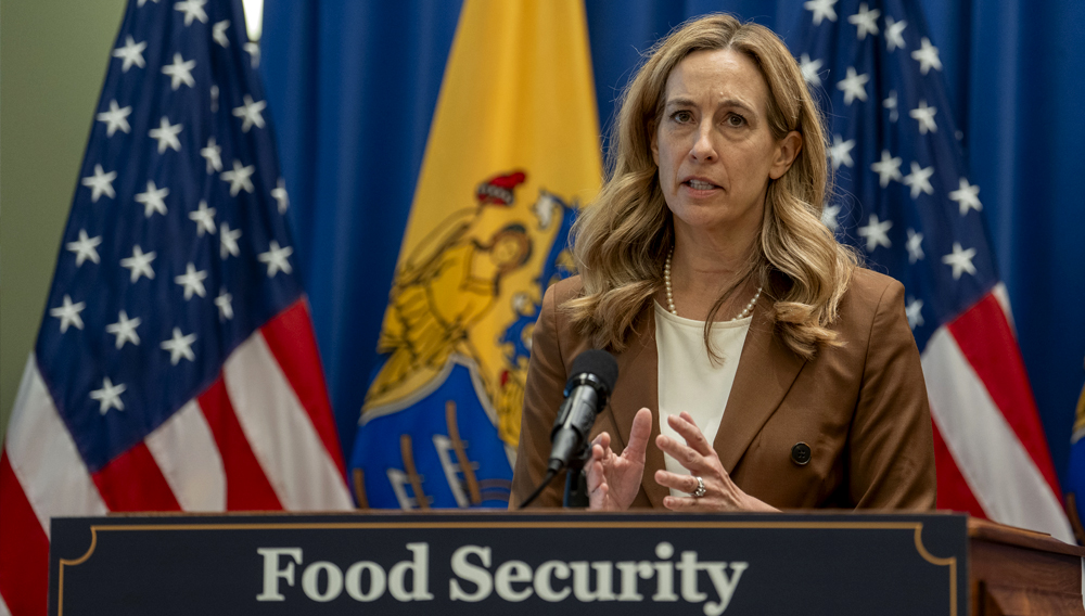 New Jersey Governor Mikie Sherrill holds press conference with Assembly Speaker Craig Coughlin; Senate Majority Leader M. Teresa Ruiz; Mark Dinglasan, Executive Director, New Jersey Office of the Food Security Advocate; and Lisa Pitz, Director, Hunger Free NJ; before signing Bill A3882 into law, which requires public schools to promote how to enroll in school meals by posting materials prominently on their websites, while in the media center of the statehouse in Trenton, N.J. on Thursday, June 18, 2026. (Office of Governor / Tim Larsen)