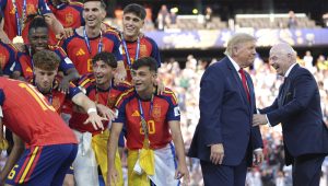 Spain players, from left, cheer alongside President Donald Trump and FIFA President Gianni Infantino at the conclusion of the World Cup championship final soccer match between Spain and Argentina in East Rutherford, N.J., Sunday, July 19, 2026. (AP Photo/Jacquelyn Martin)