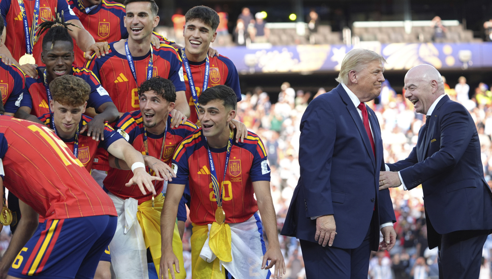 Spain players, from left, cheer alongside President Donald Trump and FIFA President Gianni Infantino at the conclusion of the World Cup championship final soccer match between Spain and Argentina in East Rutherford, N.J., Sunday, July 19, 2026. (AP Photo/Jacquelyn Martin)