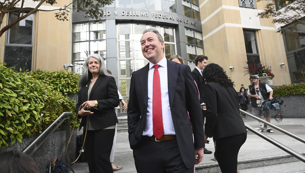 Jason Slothouber, Senior Prosecutor for the Colorado Attorney General's Office, walks outside court after tech giant Meta agreed to pay $17 billion as part of a settlement to end a landmark trial over teen social media addiction on Wednesday, Aug. 26, 2026, in Oakland, Calif. (AP Photo/Noah Berger)