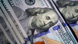 The likeness of Benjamin Franklin is seen on U.S. $100 bills, Thursday, July 14, 2022, in Marple Township, Pa. (AP Photo/Matt Slocum)