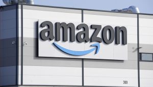 An Amazon company logo marks the facade of a building, March 18, 2022, in Schoenefeld near Berlin. (AP Photo/Michael Sohn)