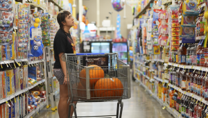 A shopper looks at items in an aisle at a grocery store in Fort Worth, Texas, Wednesday, Oct. 7, 2026. (AP Photo/LM Otero)