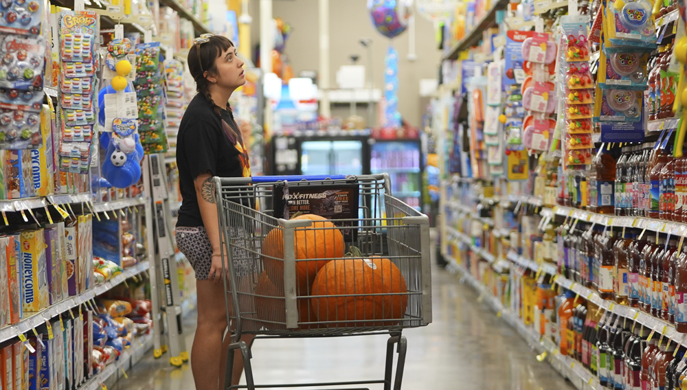 A shopper looks at items in an aisle at a grocery store in Fort Worth, Texas, Wednesday, Oct. 7, 2026. (AP Photo/LM Otero)